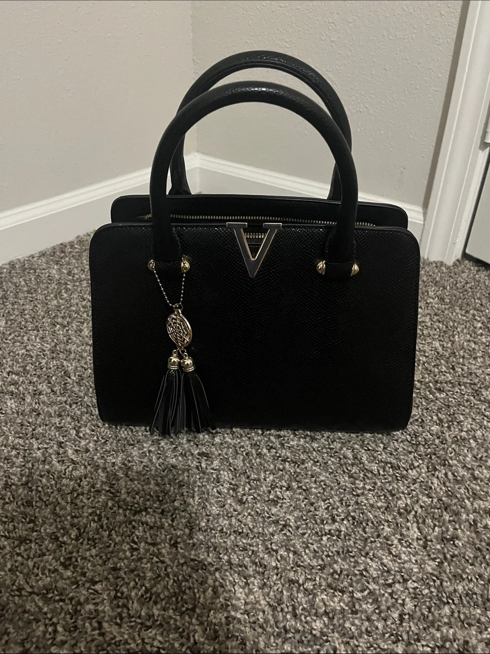 Structured Black Top-Handle Satchel with Tassel Charm